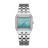 A silver women's watch with a square dial and a bracelet strap, predominantly light blue in color with diamond-like accents on the dial.