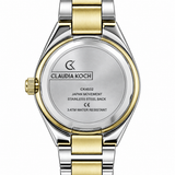 Close-up rear view of a Claudia Koch watch with a two-tone stainless steel and gold-tone metal bracelet and case, on a white background.