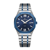 A Claudia Koch watch with a two-tone blue accent, featuring a navy dial, silver hands and markers, and a brushed stainless steel bracelet.