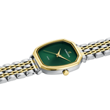 Watch with green face and gold accents on a white background