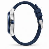 A side profile view of a watch with a dark blue silicone strap, a silver-toned case, and a matching blue bezel and crown, set against a plain white background.