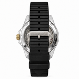 AC watch shown from the back, featuring a black ribbed silicone strap, a silver stainless steel case, and a gold-tone crown.