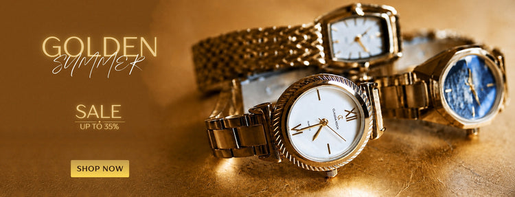 Three wristwatches displayed on a warm brown surface with promotional text reading 'GOLDEN summer SALE UP TO 30%' and a 'SHOP NOW' button. The watches include gold-tone metal cases and bands, one with a white dial and one with a blue dial.